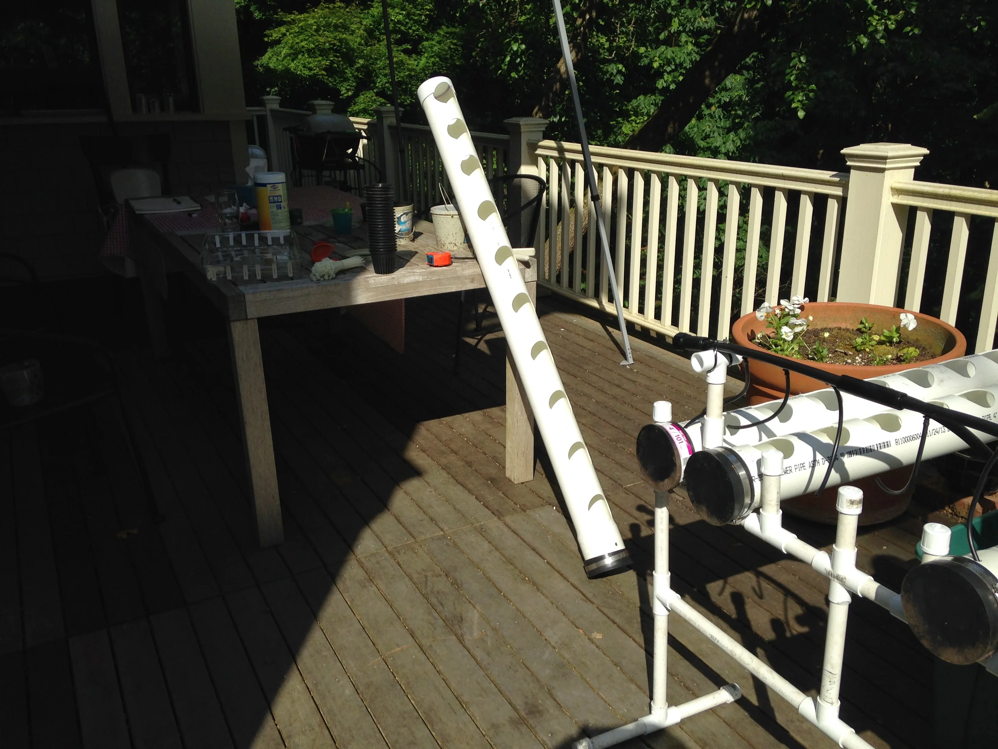 Early hydroponic system under construction from PVC on a deck